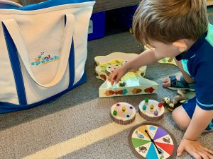 young boy playing a board game